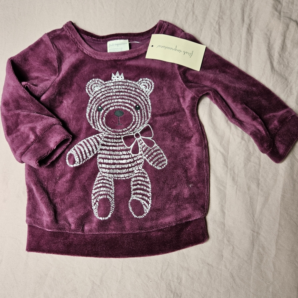 Buzo violeta de bebe